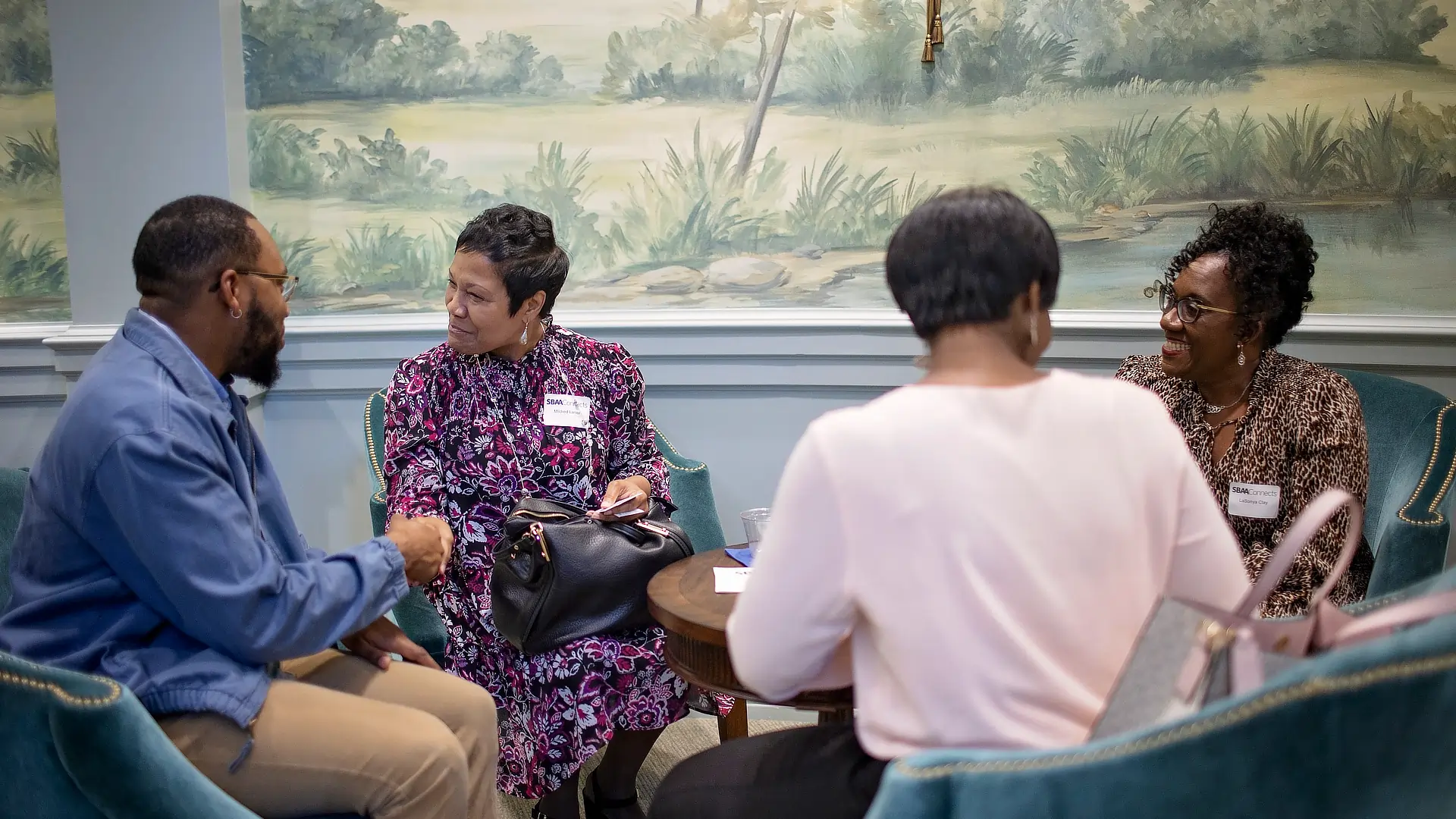 family visiting alumni center