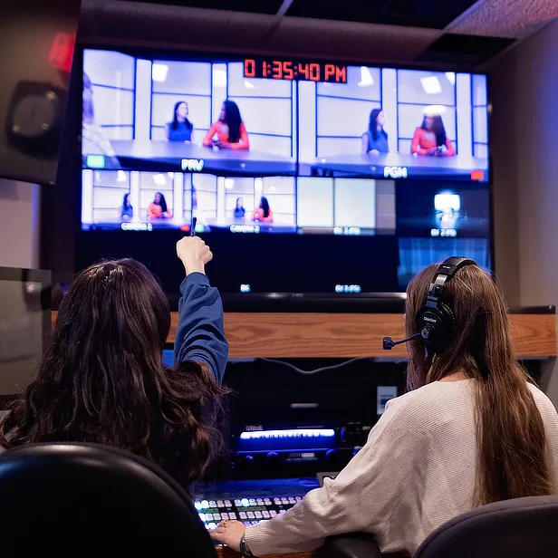 student directing the broadcast