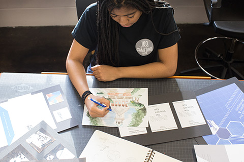 Student drawing on table