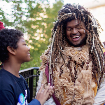 student in lion costume