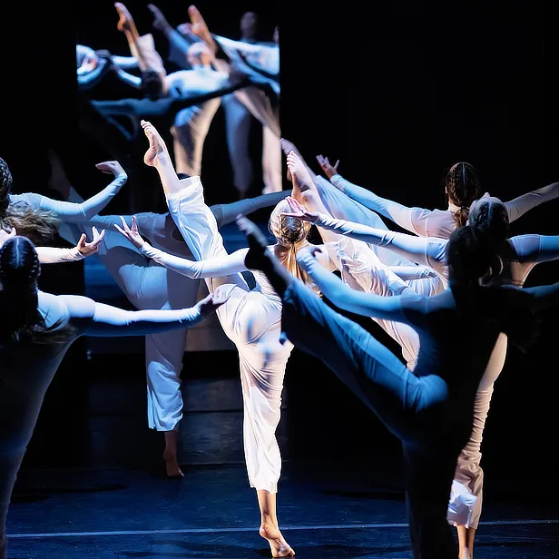 dancers on stage with mirror