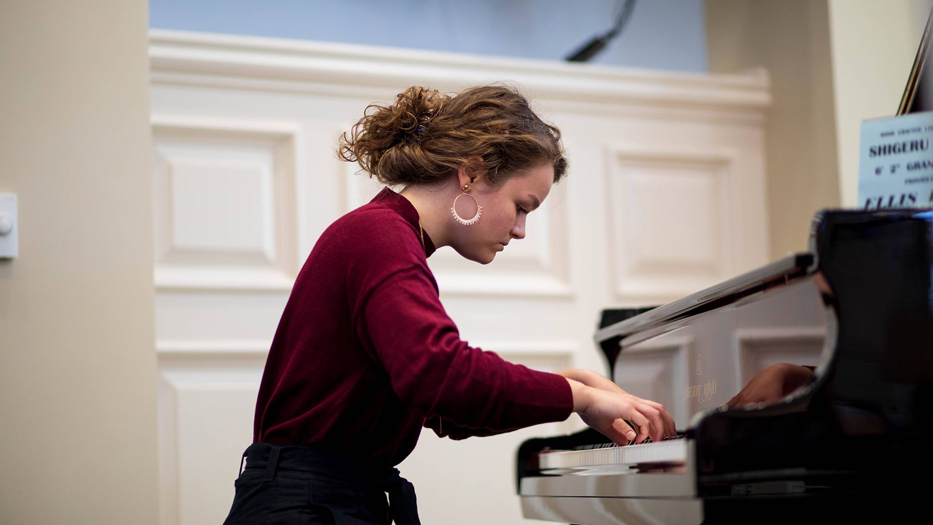 student playing piano banner