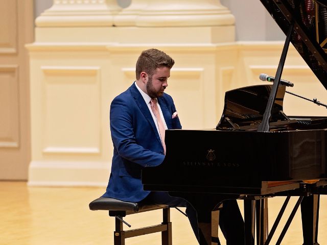 Briggs Cooper Playing Piano