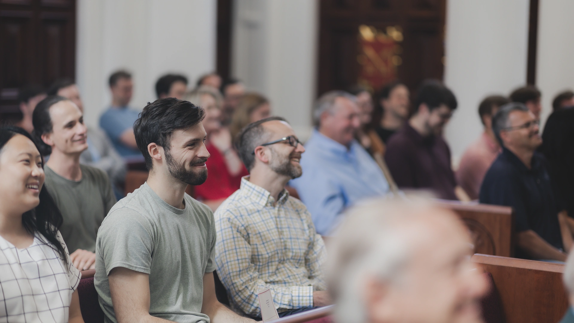 student sitting in chapel
