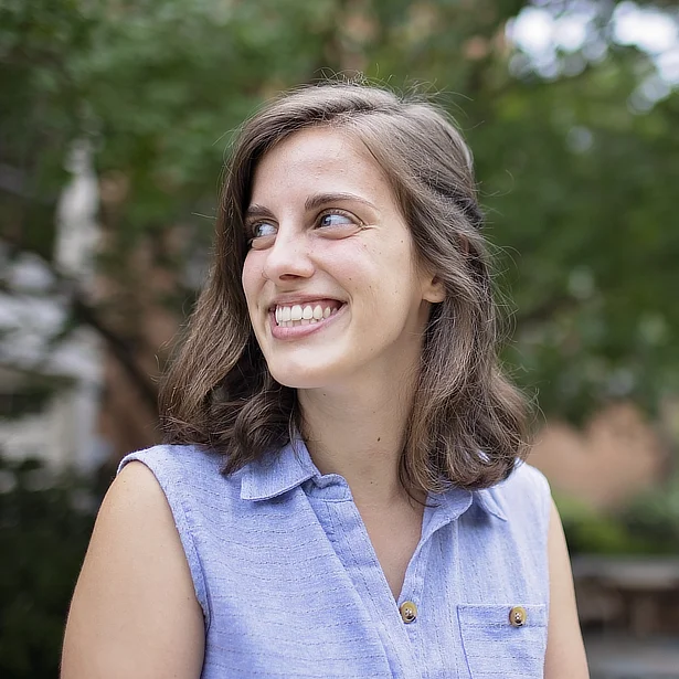 female student smiling outside