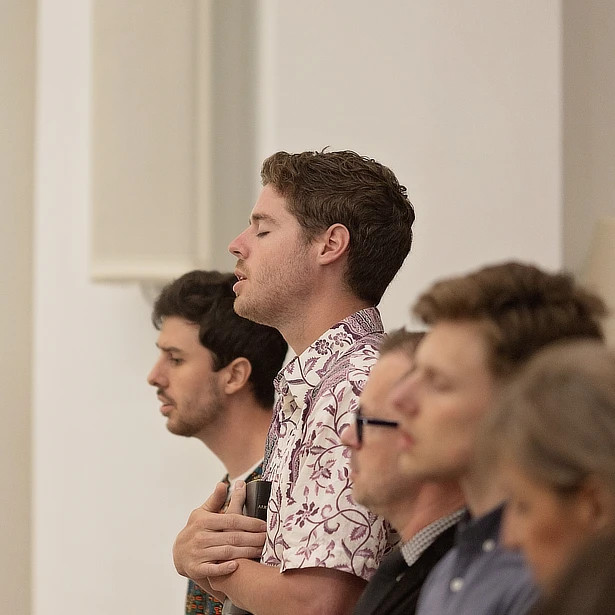 students standing in chapel