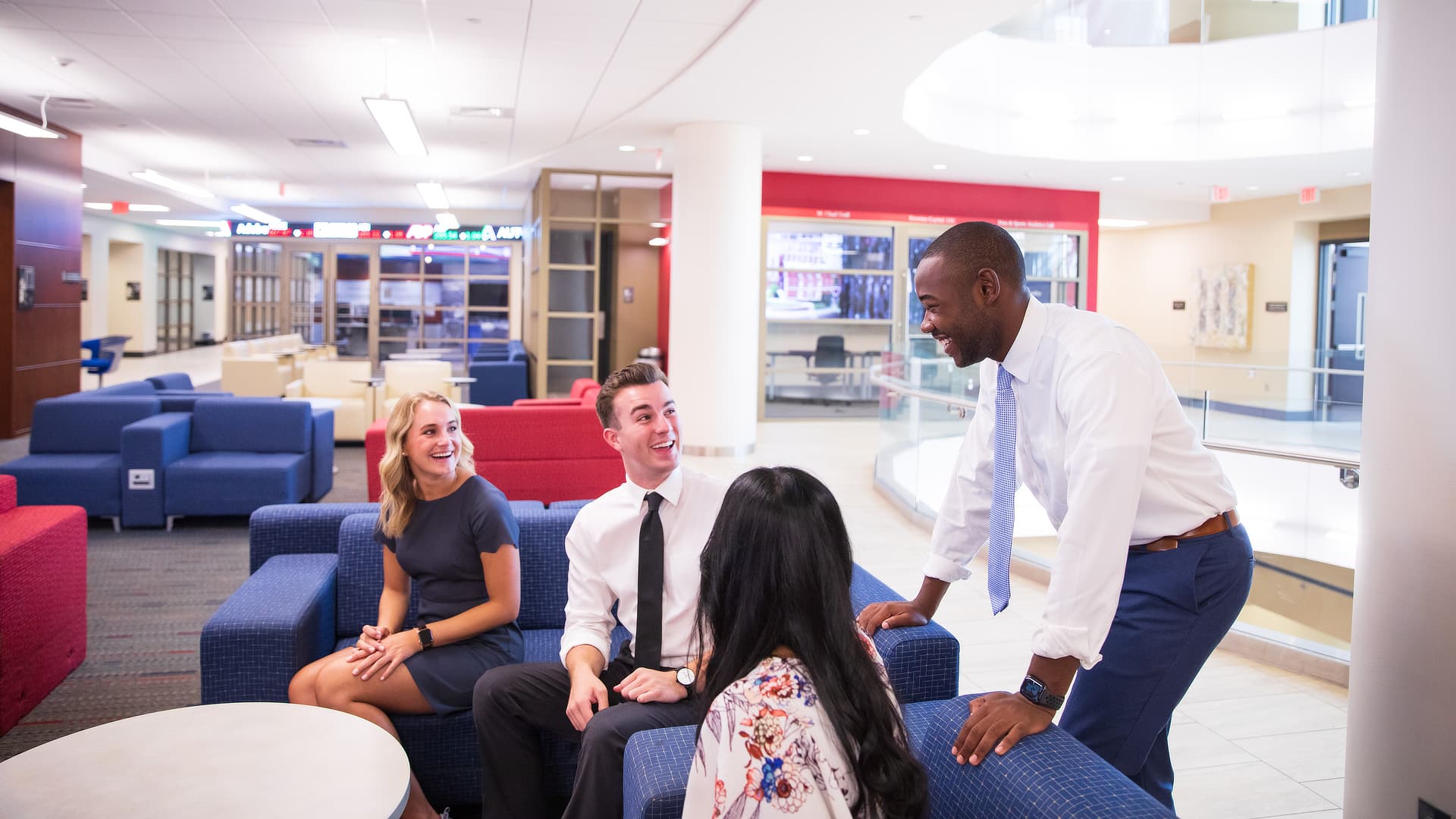 Four business students relaxing SD0721733