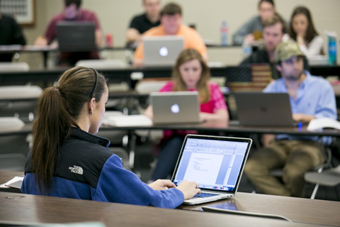 classroom with female student in foreground