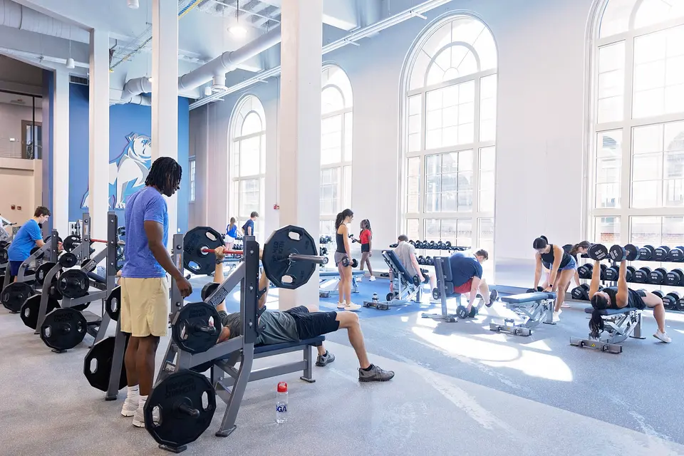 Students Using Weight Room Equipment