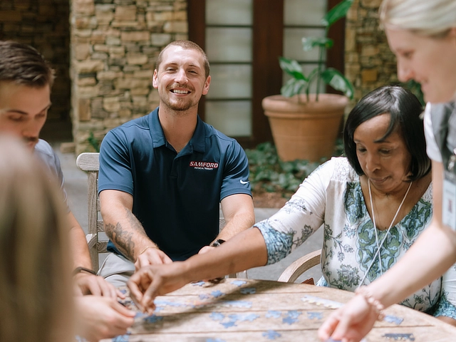 physical therapy student with patient