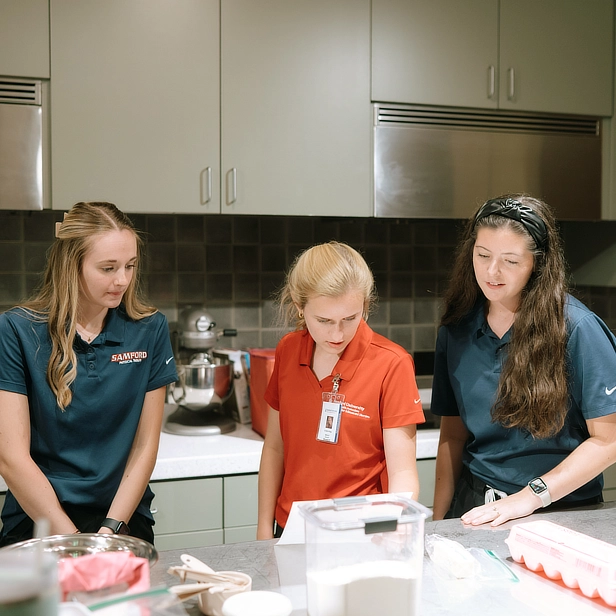Physical therapy students in kitchen