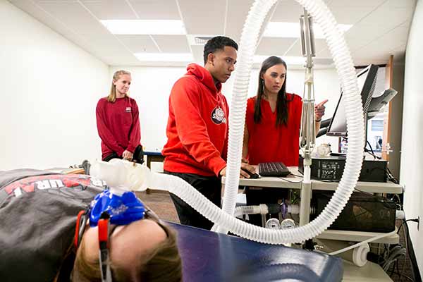 Male and female students testing metabolic rate