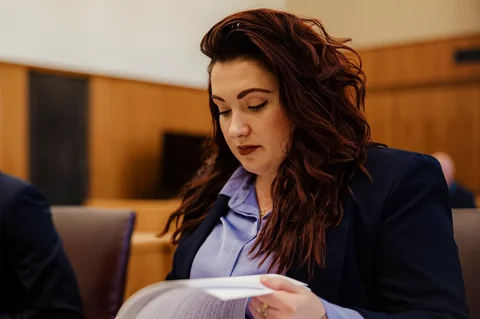 female law student studying for trial