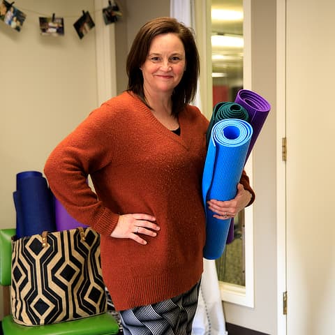 Lynn Hogewood with yoga mats