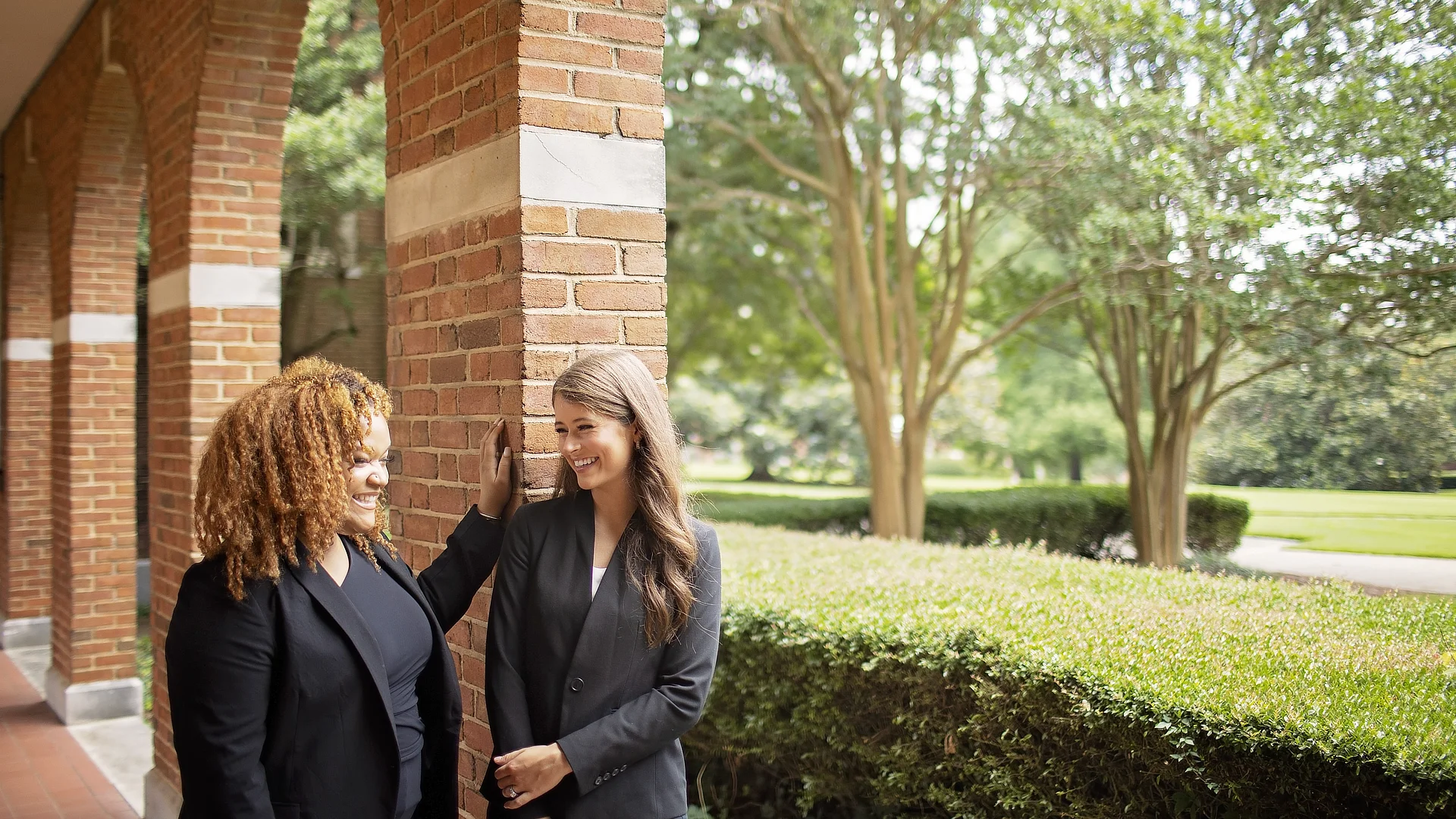 female law students chatting outside