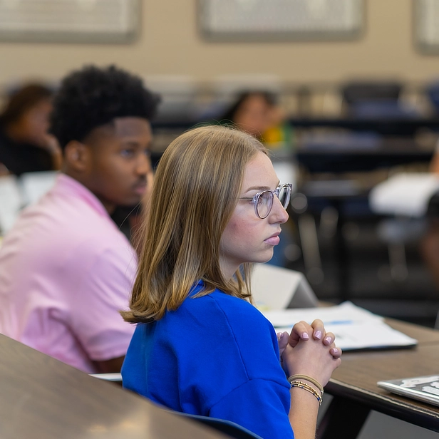 female law student in class