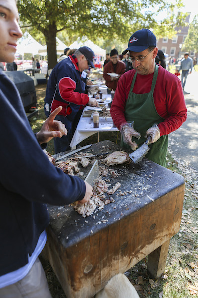 Randy Todd preparing barbecue on the quad