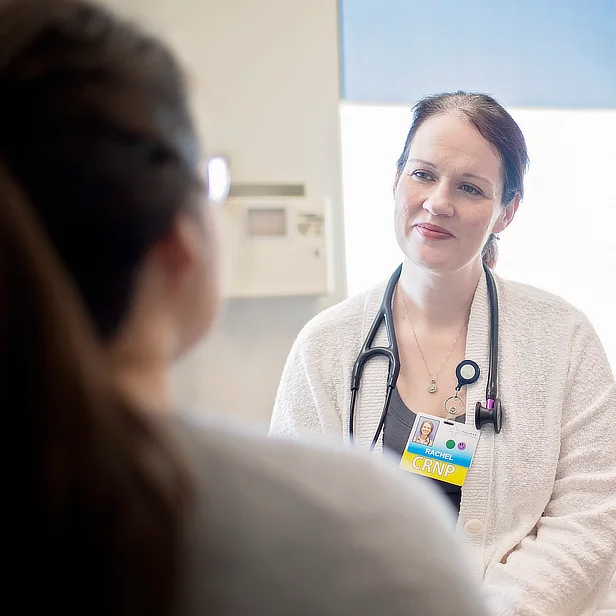 Nurse Practitioner with Patient