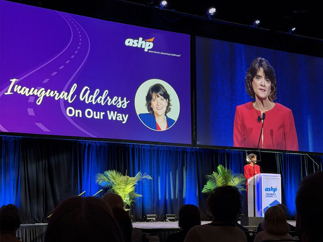 female professor podium benner inauguration ashp