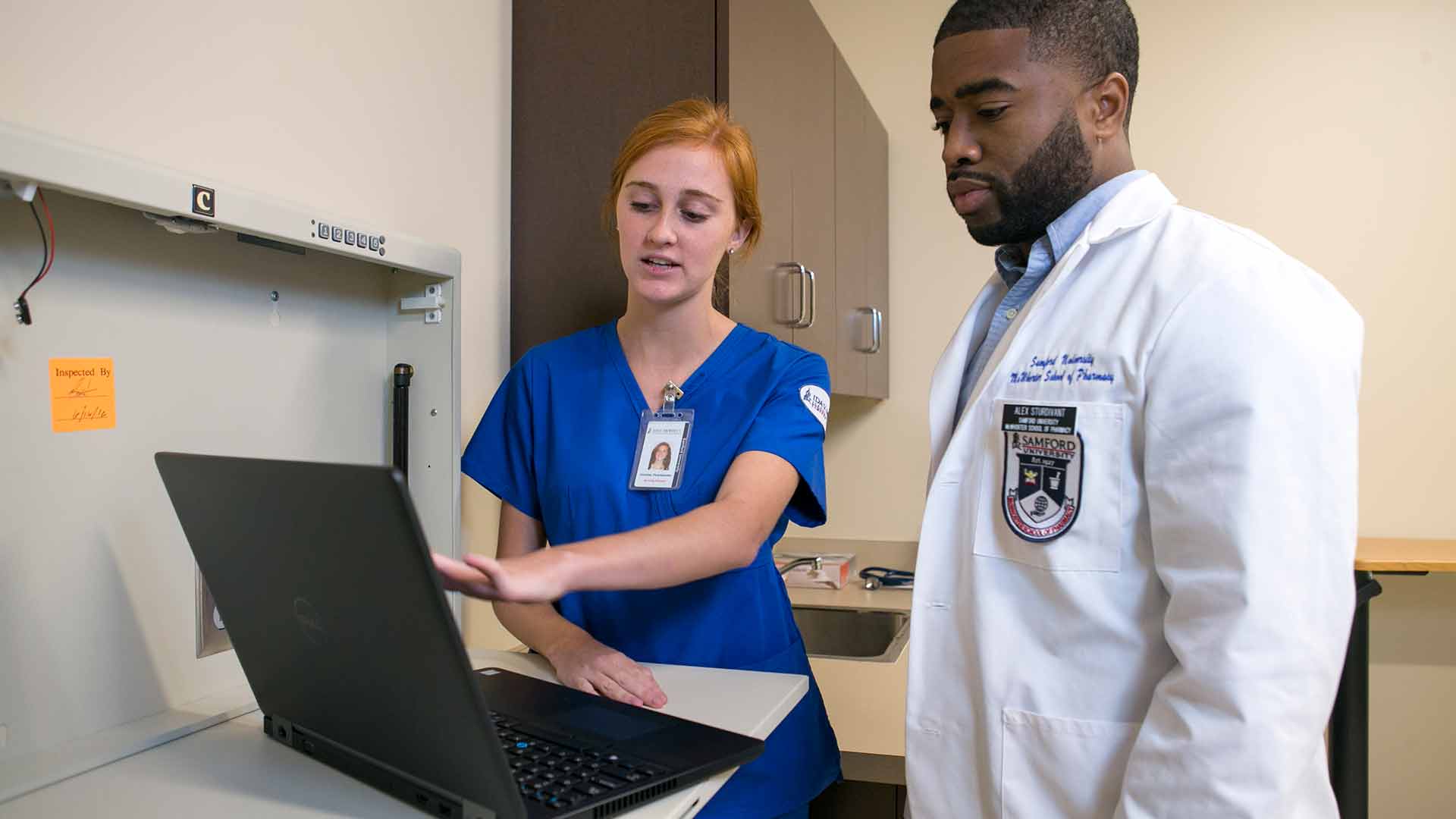 white female nursing student and black male pharmacy student