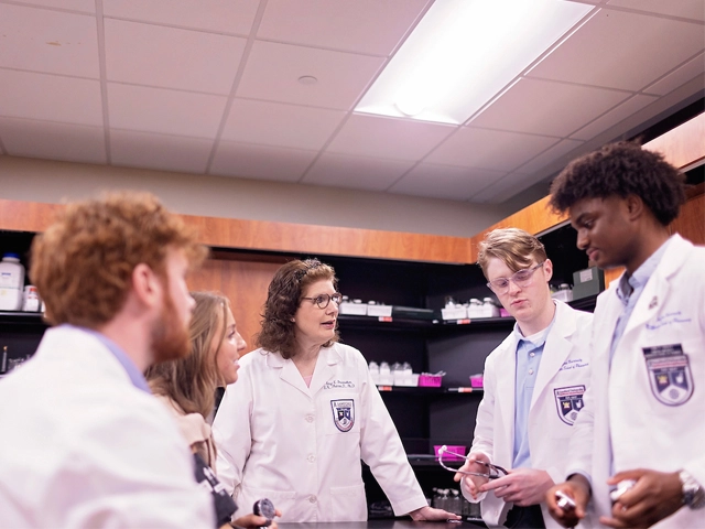 pharmacy students and faculty in lab