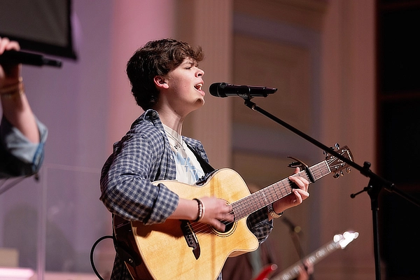 Worship-Student-Playing-Guitar.webp