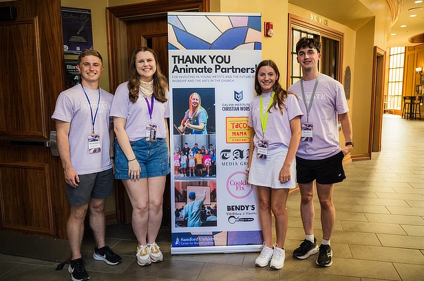 four student by a sign