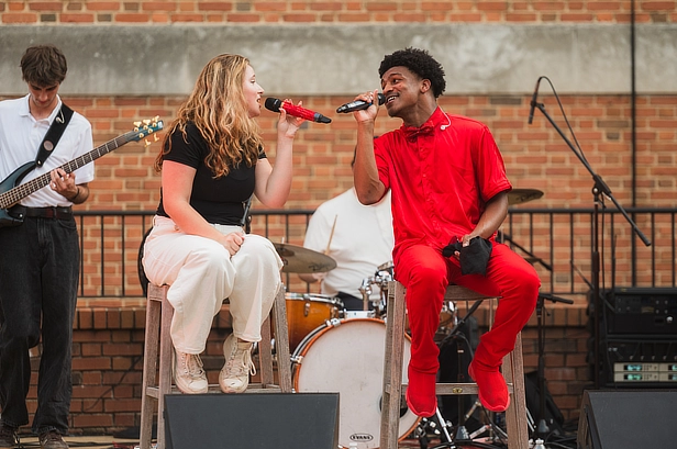 two students singing